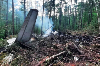 Расчистка места крушения Ан-24 в Амурской области: что известно о расследовании